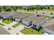 An aerial shot showing several homes and properties with fenced yards and mature landscaping at 14498 Whitewater Way, Brooksville, FL 34604