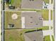 Aerial shot of backyard featuring large yard with fence, a storage building and patio at 14498 Whitewater Way, Brooksville, FL 34604
