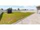 Spacious backyard featuring a storage shed and new fence at 14498 Whitewater Way, Brooksville, FL 34604