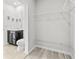 Bathroom with walk in closet, tile flooring and black vanity at 14498 Whitewater Way, Brooksville, FL 34604