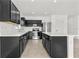 Modern kitchen with stainless steel appliances, a central island, and sleek cabinetry at 14498 Whitewater Way, Brooksville, FL 34604