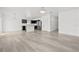 Inviting living space flows seamlessly into the modern kitchen with stainless steel appliances at 14498 Whitewater Way, Brooksville, FL 34604