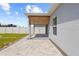 View of a covered patio with roll down shade, and a fenced in yard at 14498 Whitewater Way, Brooksville, FL 34604