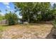 Large backyard with a charming patio set amidst greenery, ideal for enjoying peaceful moments outdoors at 1526 San Mateo Dr, Dunedin, FL 34698