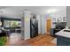Bright kitchen with gray cabinets and stainless steel appliances at 1526 San Mateo Dr, Dunedin, FL 34698