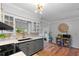 Modern kitchen features gray cabinets, stylish lighting, and backsplash at 1526 San Mateo Dr, Dunedin, FL 34698