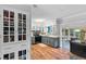 Well-lit kitchen features gray cabinets, backsplash, and stylish lighting fixtures at 1526 San Mateo Dr, Dunedin, FL 34698