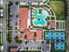Bird's eye view of community center with tennis courts, pool and clubhouse at 17222 Holly Well Ave, Wimauma, FL 33598