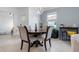 Bright dining room with a chandelier and a view to a Cold Drink station at 17222 Holly Well Ave, Wimauma, FL 33598