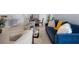 Spacious living room showcasing a view into the kitchen and dining room at 17222 Holly Well Ave, Wimauma, FL 33598