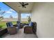 Relaxing screened patio with comfortable seating and views of the backyard at 17222 Holly Well Ave, Wimauma, FL 33598