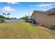 Expansive backyard with white fence, mature trees, and potential for outdoor activities at 1851 Skyland Dr, Clearwater, FL 33759