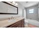 Bathroom featuring a large vanity with a sink and a shower/tub combination at 1851 Skyland Dr, Clearwater, FL 33759