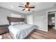 The bedroom includes a fan, and luxury vinyl floors at 1851 Skyland Dr, Clearwater, FL 33759