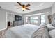 Bright bedroom featuring a dresser, bay window and wood-look floors at 1851 Skyland Dr, Clearwater, FL 33759