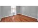 The empty room features wood flooring and a window at 1851 Skyland Dr, Clearwater, FL 33759
