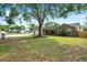 Charming single-Gathering home with mature tree in the front yard and well-manicured lawn at 1851 Skyland Dr, Clearwater, FL 33759