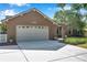Lovely home featuring a two-car garage and meticulously maintained landscaping with a long driveway and inviting curb appeal at 1851 Skyland Dr, Clearwater, FL 33759