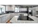 Bright, updated kitchen with stainless steel appliances, a center island, and sleek, modern design at 1851 Skyland Dr, Clearwater, FL 33759
