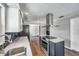 Spacious kitchen with hardwood floors, an island cooktop, stainless steel appliances, and recessed lighting at 1851 Skyland Dr, Clearwater, FL 33759