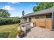 Well-equipped outdoor kitchen and barbecue area with brick-paved patio at 1851 Skyland Dr, Clearwater, FL 33759