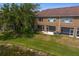 Aerial view of backyard with pond, screened in porch, and landscaping at 18939 Duquesne Dr, Tampa, FL 33647