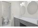 Well-lit bathroom features a large vanity with plenty of counter space and a shower-tub combo at 18939 Duquesne Dr, Tampa, FL 33647