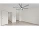 Large bedroom with modern ceiling fan and two spacious closets, offering ample storage at 18939 Duquesne Dr, Tampa, FL 33647