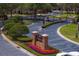Community entrance with manicured landscaping and signage at 18939 Duquesne Dr, Tampa, FL 33647