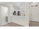 Open concept kitchen featuring white cabinets, quartz counters, stainless appliances, and eat-in bar at 18939 Duquesne Dr, Tampa, FL 33647