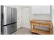 Contemporary kitchen featuring stainless steel refrigerator and prep table in a well-lit area at 18939 Duquesne Dr, Tampa, FL 33647