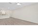 Bright and airy living room featuring neutral walls and modern vinyl floors throughout the home at 18939 Duquesne Dr, Tampa, FL 33647