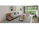 Stylish living room with modern decor, wood floors, and sliding glass doors leading to a screened patio at 18939 Duquesne Dr, Tampa, FL 33647