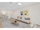 Inviting living room with wood floors, modern decor, and an open layout leading to the kitchen and dining area at 18939 Duquesne Dr, Tampa, FL 33647