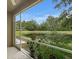 View from the screened patio looking out onto the pond and landscaping at 18939 Duquesne Dr, Tampa, FL 33647