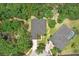 Aerial view of house showcasing roof and landscaping in a serene, wooded area at 1934 Samantha Ln, Valrico, FL 33594