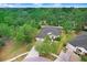 Aerial view of the home showcasing its well-maintained landscaping, large backyard and mature trees at 1934 Samantha Ln, Valrico, FL 33594