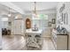 Inviting dining area with stylish table setting, large windows, and ample natural light at 1934 Samantha Ln, Valrico, FL 33594