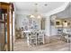 Bright dining room with wood floors, decorative accents, and a view into the kitchen at 1934 Samantha Ln, Valrico, FL 33594