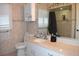 Elegant bathroom featuring neutral tile, shower and built in shelving at 1961 Dunbrody Ct, Dunedin, FL 34698