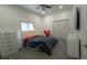 Neutrally decorated bedroom with a closet, window, and grey carpet flooring at 1961 Dunbrody Ct, Dunedin, FL 34698