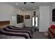Spacious bedroom featuring a king bed, light walls, and a door to the backyard at 1961 Dunbrody Ct, Dunedin, FL 34698