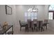 Dining room with hardwood floors, shutters on the windows and modern decor at 1961 Dunbrody Ct, Dunedin, FL 34698