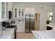 Modern kitchen with stainless steel appliances, white cabinets, and marble countertops at 1961 Dunbrody Ct, Dunedin, FL 34698