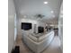 Panoramic view of the living room with hardwood floors and recessed lighting at 1961 Dunbrody Ct, Dunedin, FL 34698