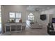Expansive living room featuring a sofa, fish tank, and hardwood floors at 1961 Dunbrody Ct, Dunedin, FL 34698