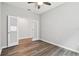 Bright bedroom with modern ceiling fan and wood-look flooring at 20033 Sea Glass Cir, Land O Lakes, FL 34638