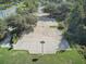 Overhead aerial view of a full basketball court with surrounding trees at 20102 Oakflower Ave, Tampa, FL 33647