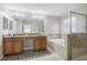 Bathroom featuring double vanity, soaking tub, and separate shower, offers a spa-like retreat at 20102 Oakflower Ave, Tampa, FL 33647