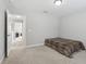 Spacious bedroom featuring neutral carpet, and an easy access door to the rest of the house at 20102 Oakflower Ave, Tampa, FL 33647